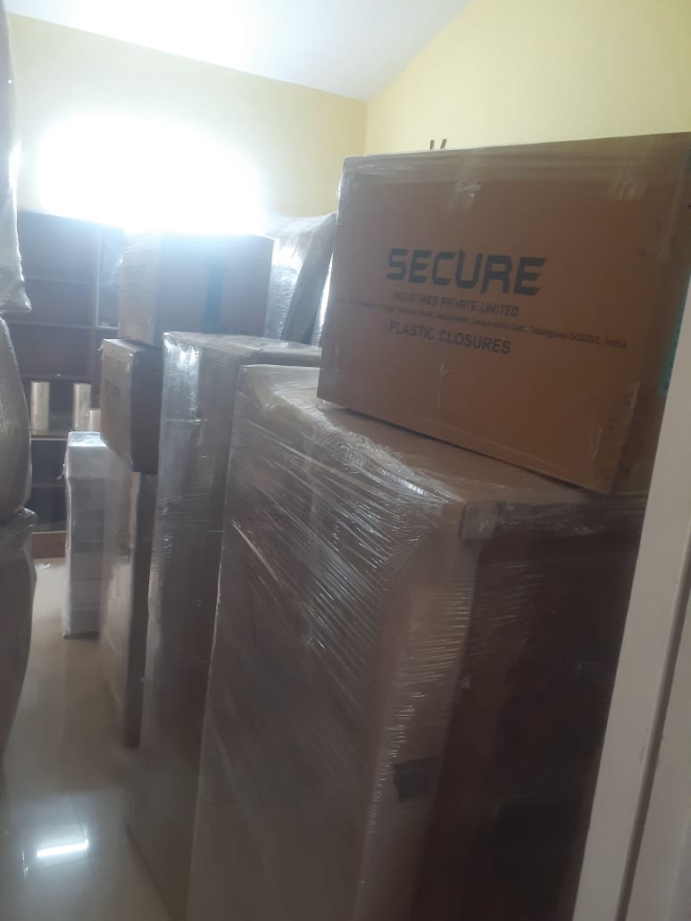 Moving team handling cartons carefully